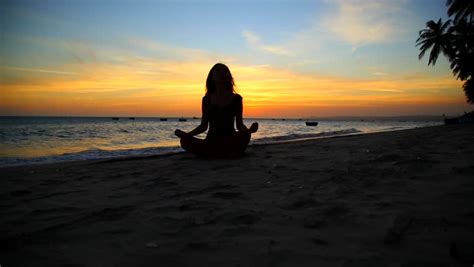 Silhouette Of A Beautiful Yoga Woman In The Morning On A