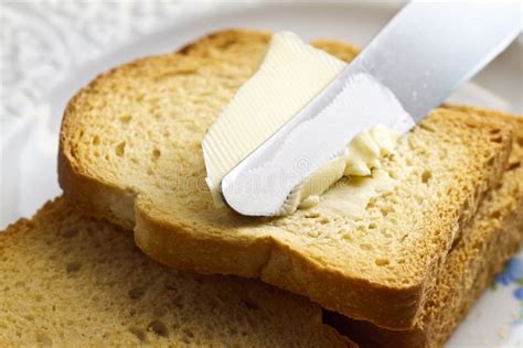 Spreading Butter On Bread Stock Photo Image Of Piece 19317562
