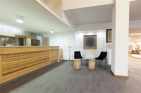 Spacious Hotel Lobby With Reception Desk Stock Image