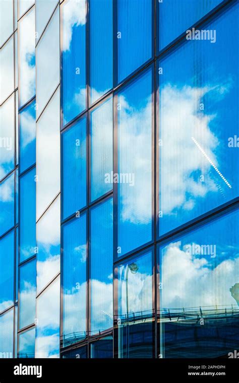 Reflections Of The Sky In The Glass Facade Of The Building Stock Photo