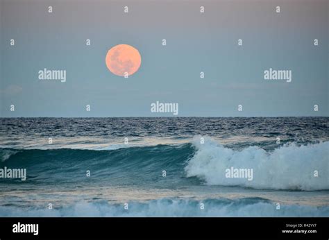 Full Moon Over The Ocean Stock Photo Alamy