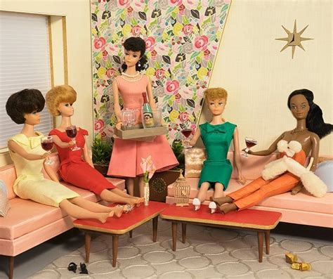 There Are Many Dolls That Are Sitting On The Couch