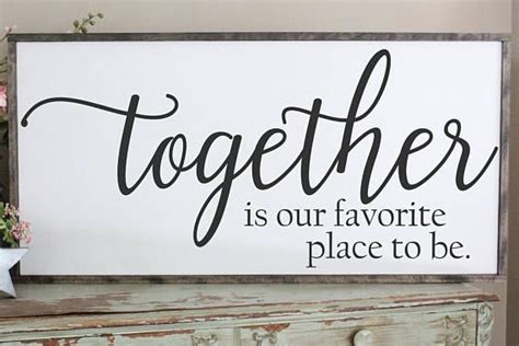 Together Is Our Favorite Place To Be Sign Over The Bed