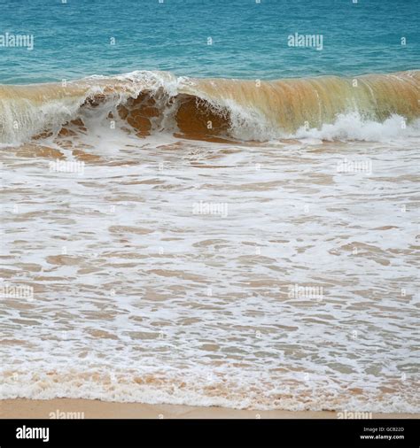 Waves Sea And Yellow Sand Stock Photo Alamy