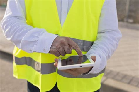 Close Up View Of An Architect Or Engineer Man Hands Using Tablet On The