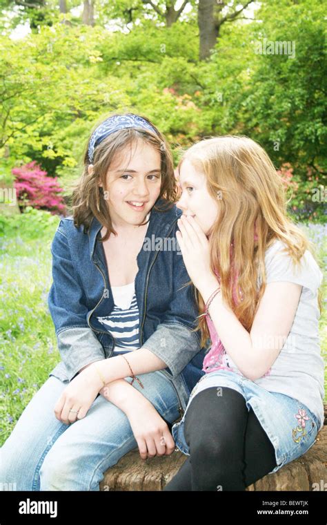Two Young Girl Friends Talking And Chatting Stock Photo Alamy