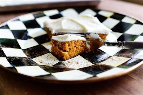 A Piece Of Cake On A Checkered Plate With A Fork