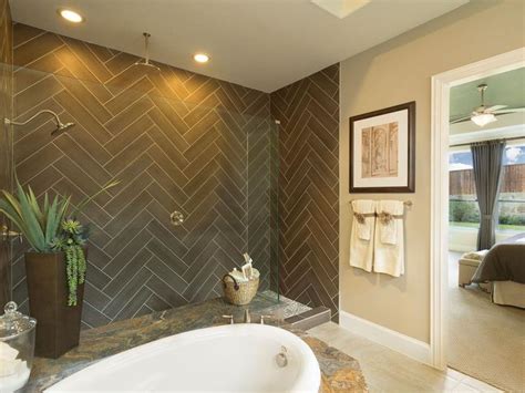 This master bathroom's sparkling chandelier, crystal clear mirrors, and remarkably lovely cabinets and drawers single stripes of blue adorn the shower stall and wall behind the sink. 15 Stunning Master Bathrooms with Walk-In Showers