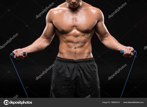 Мускулистый человек с скакалкой — Стоковое фото © DmitryPoch #168824410