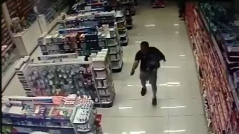 Watch This Brazilian Cop Shoot Armed Robbers While Holding His Infant