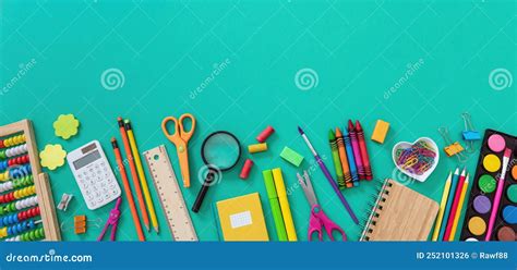Back To School School Office Supplies And Stationery On Green Color