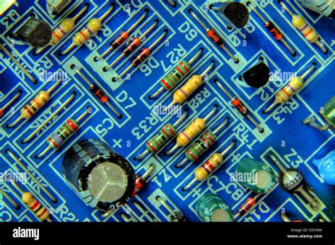 Blue Printed Circuit Board With Resistors Capacitor And Transistors