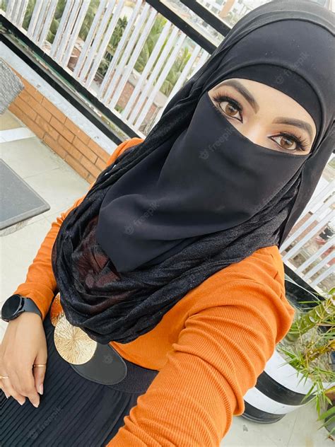 premium photo a woman wearing a black hijab and a black hijab