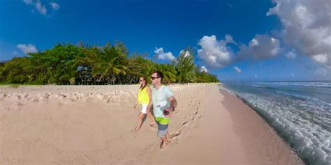 Selfie Young Couple Strolls Down The White Sand Shore Of Remote