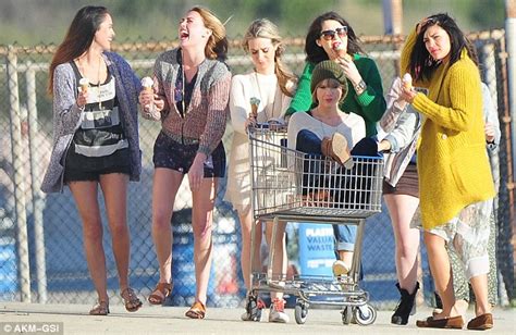 Taylor Swift Performs Her Own Stunt Atop A Shopping Cart As She Films