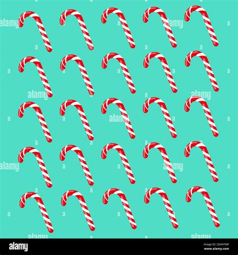 Red And White Striped Candy Canes On A Chocolate Background Stock