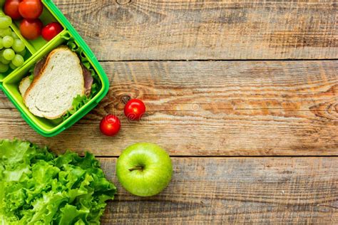 School Lunch Set With Apple And Vegetables In Lunchbox Background Top