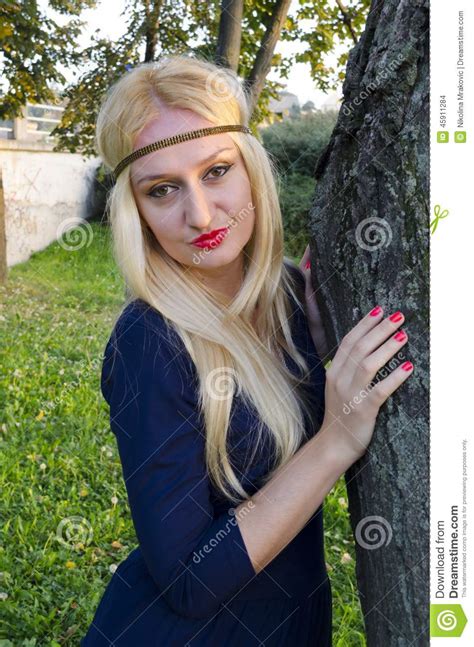 Young Blond Woman In The Park Near The Tree Stock Photo Image Of