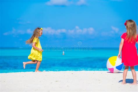 Little Adorable Girls Playing On Beach With Air Stock Photo Image Of