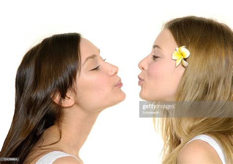 Side Profile Of Two Young Women Kissing Each Other Photo Getty Images