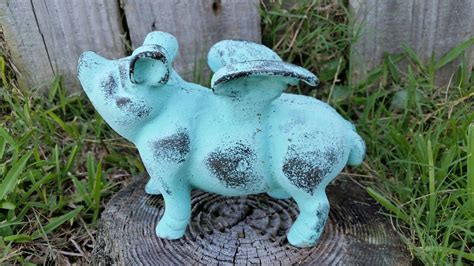 Resin art is prone to fading. Cast Iron Flying Pig | Cast iron decor, Flying pig garden ...