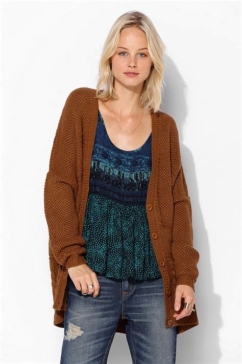 Super easy to throw on and chill in, a chunky cardigan is a great asset to your casual wardrobe. Lyst - Urban Outfitters Chunky Cable Knit Cardigan in Brown