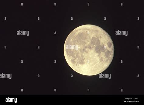 Luminous Full Moon Against A Black Sky Stock Photo Alamy