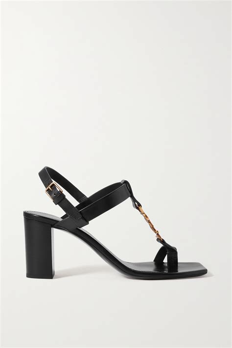 saint laurent cassandra logo embellished leather sandals in black modesens