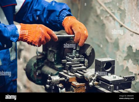 closeup of repairman in uniform professional builder working using construction equipment