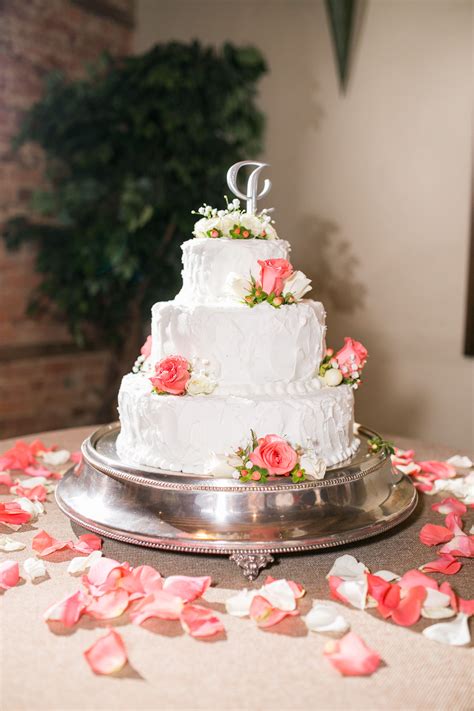 Buttercream Wedding Cake With Coral Roses