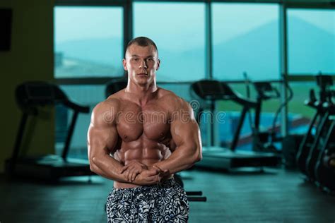 Young Bodybuilder Flexing Muscles Stock Photo Image Of Ethnicity