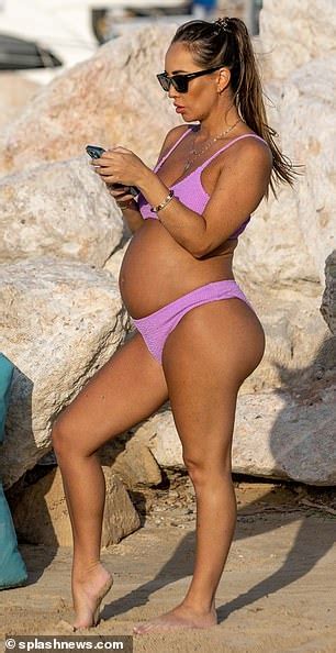 Pregnant Lauryn Goodman Shows Off Her Baby Bump In A Bikini On The