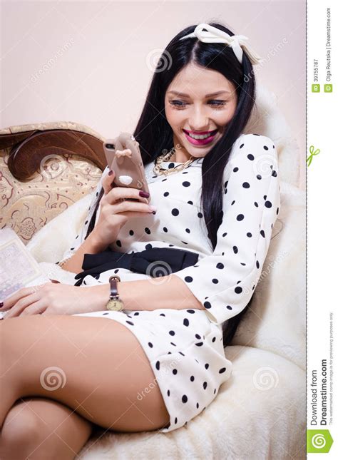 Beautiful Pinup Woman Looking Happy Smiling With Mobile Phone Stock