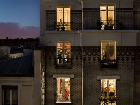 Voyeuristic Photos Capture Intimate Scenes Through Apartment Windows In