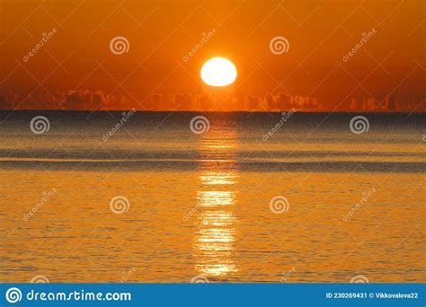 Beautiful Red Sunset Over The Sea Horizon With Clouds Nature