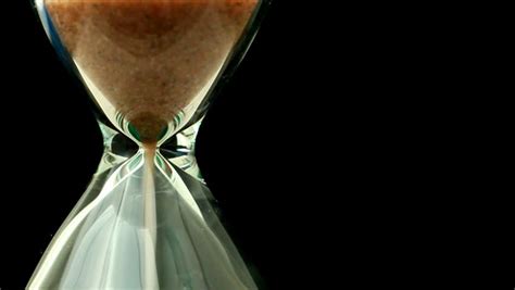 Slowly Rotating Hourglass With Sand Running Through Stock Footage Video