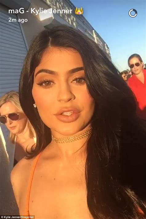 Kylie Jenner Flashes Plenty Of Flesh In Orange Split Dress At