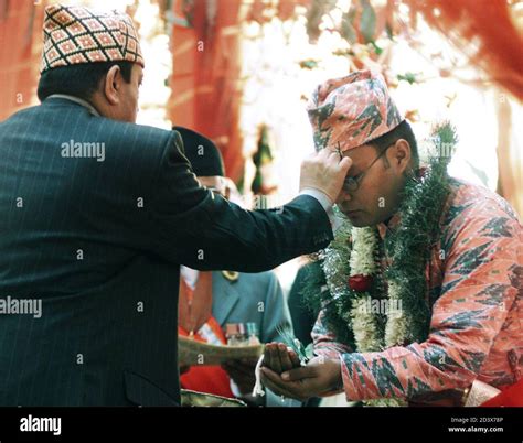 king gyanendra l of nepal place a tika on the forehead of his would be son in law raj