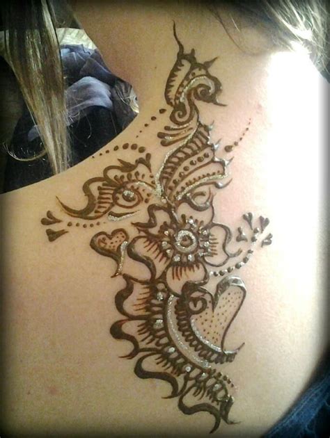 Henna tattoos on lower back. Neck back tattoo henna