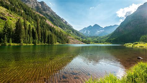 Body Of Water Surrounded By Mountain During Daytime Hd Wallpaper