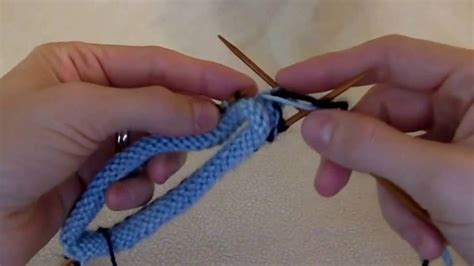 You knit a latvian braid as follows: Latvian braid first purl round - YouTube