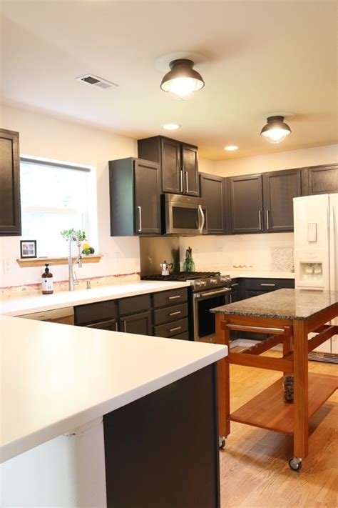 Consider updating your cabinetry with a fresh coat of paint. Benjamin Moore Black Kitchen Cabinet Colors - Petite ...