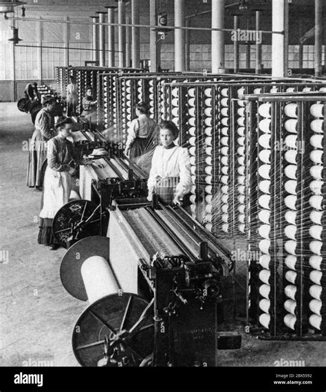 In A Cotton Spinning Mill Female Workers Operate The Spinning Machines