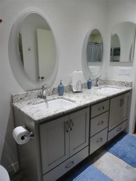 Black galaxy granite with white cabinets backsplash ideas. galaxy white granite, BM revere pewter cabinet with drawer ...