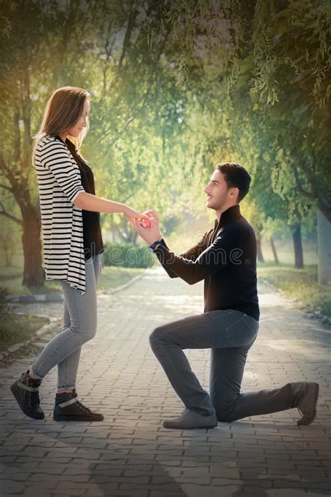 Funny proposal messages for boyfriend a funny proposal message brings a sweet smile on your boyfriend's face. Kneeling Man Proposing With An Engagement Ring Stock Photo - Image of boyfriend, girlfriend ...