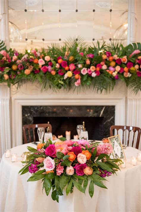 Colorful Sweetheart Table Topped With Bright Garland Of Fern Garden