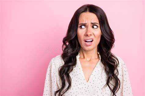 Portrait Of Unsatisfied Questioned Girl Look Empty Space Open Mouth On Pink Color Background