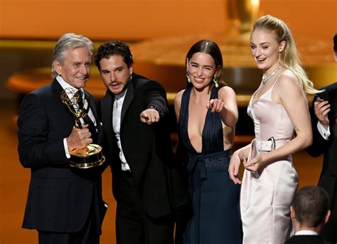 Instead, they were filming their kiss in front of a green. Kit Harington and Emilia Clarke Hug It Out at the Emmys ...