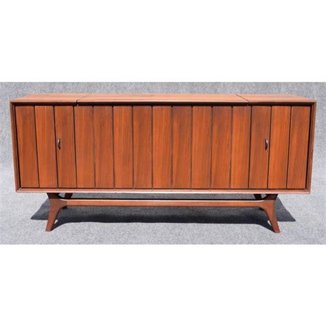 Determining the worth of a working record player and radio in a wood cabinet may require some research. Vintage Zenith Mid-Century Modern Stereo Console | Chairish