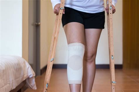 Woman Patient Using Crutches And Broken Legs For Walking